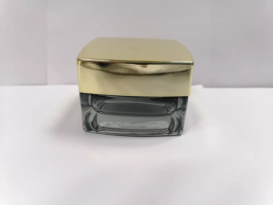 Γκρίζο χρώμα που λουστράρει τα καλλυντικά βάζα βάζων 30g 50g Skincare γυαλιού με τα χρυσά καπάκια με λάκκα